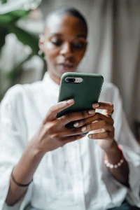 woman taking picture on phone